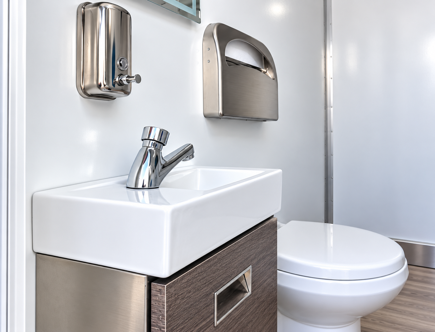 Sink interior of a commercial mobile restroom trailer